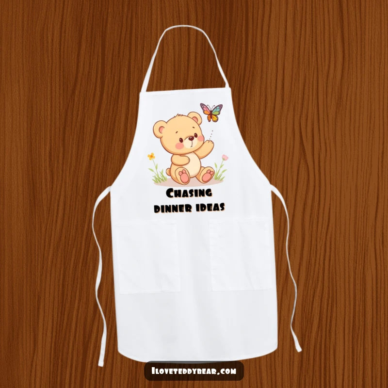 Funny apron featuring a teddy bear playfully chasing a bouncing butterfly, ideal for kitchen tasks with a touch of charm.