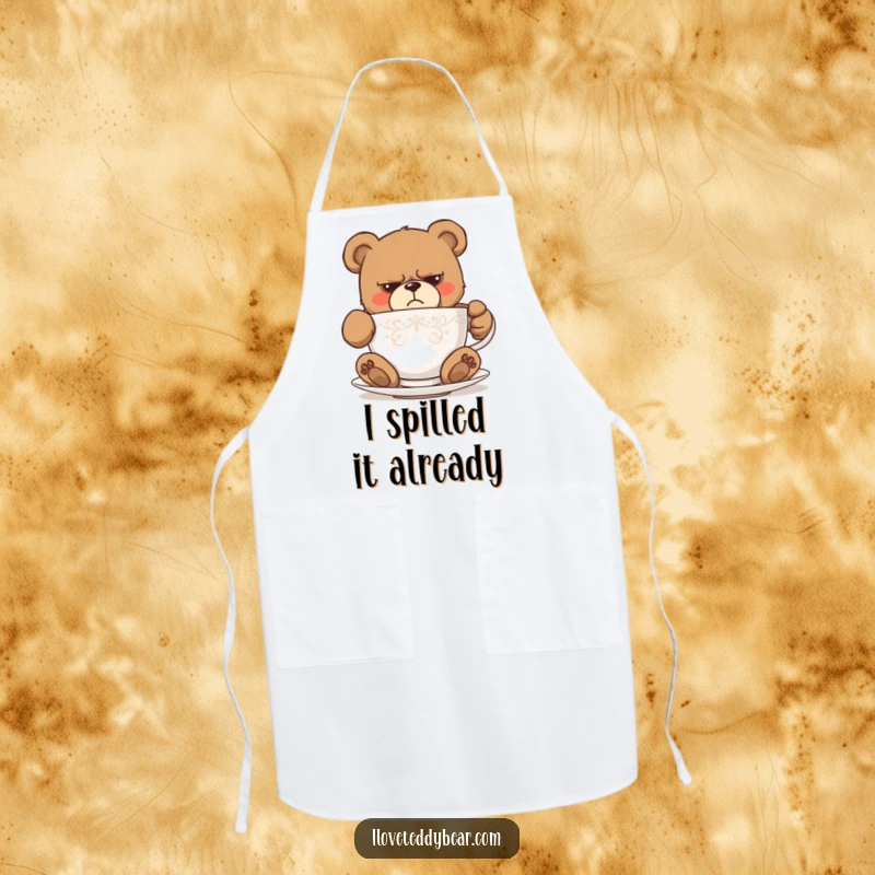 Funny apron showing a grumpy teddy bear comically stuck inside a very small teacup, perfect for kitchen humor. A great funny gift.