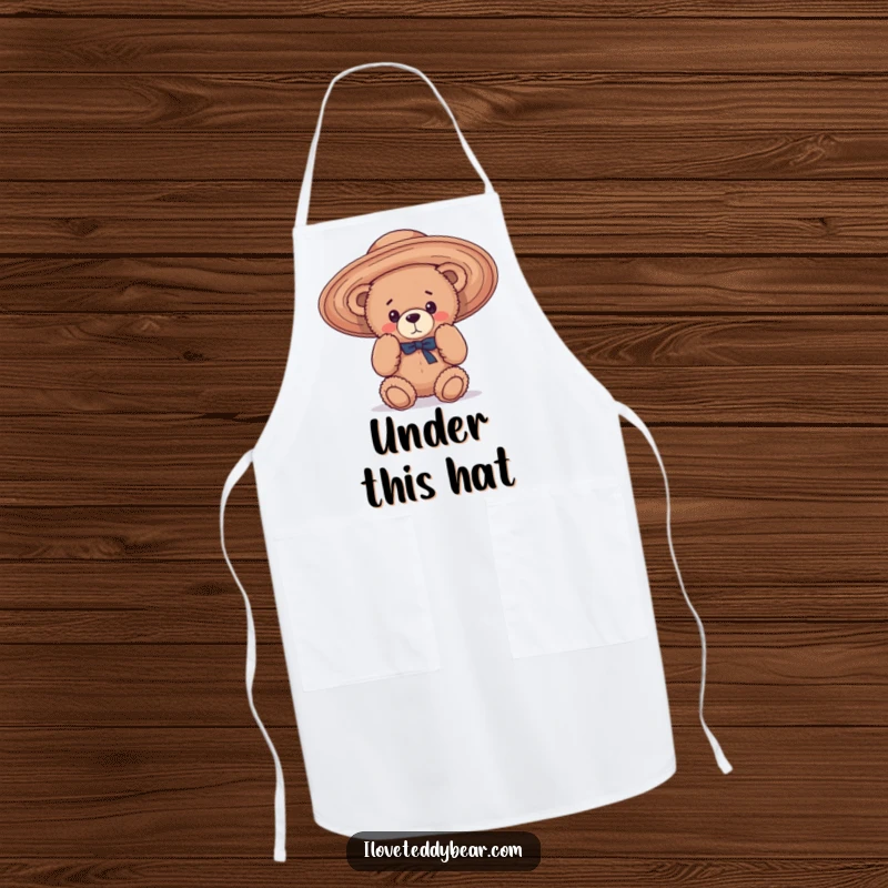 Funny Apron showing a teddy bear hilariously struggling to wear an oversized, floppy hat, bringing playful charm to the kitchen.