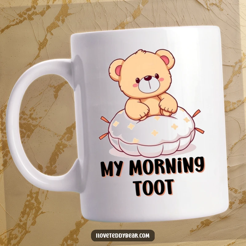 Funny teddy bear mug showing a bear with a shocked expression, having accidentally sat on a whoopee cushion.