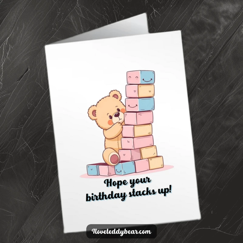 Funny Free Printable Birthday Card: A teddy bear attempting to build a precarious block tower, highlighting effort and imminent collapse.