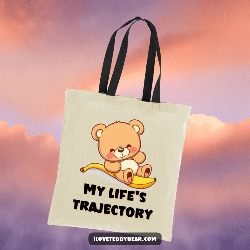 Funny teddy bear tote bag illustrating a bear comically slipping on a banana peel, a humorous and eye-catching design.