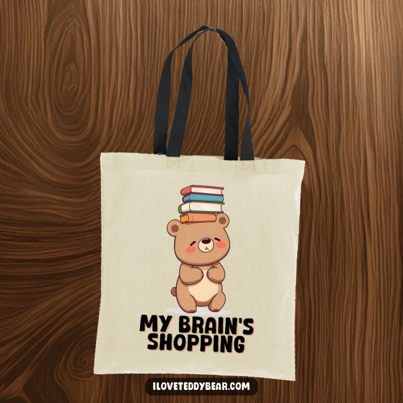 Funny tote bag design with a bear giggling while precariously balancing a tall stack of books on its head.